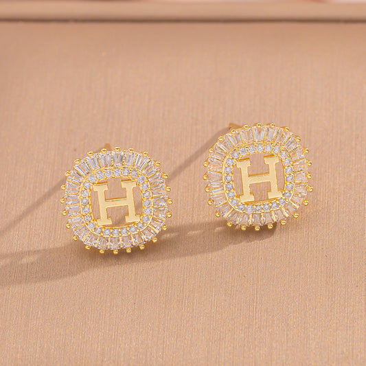 Обеци с циркон и буквата H